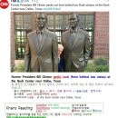 #CNN #KhansReading 2017-07-15-3 Former President Bill Clinton peeks out from behind two status 이미지