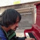 Man on the street plays beautifully 이미지