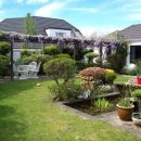 뉴질랜드의 멋진 정원을 가진 집 이미지