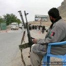 An Afganistan policeman sit at ~ 이미지